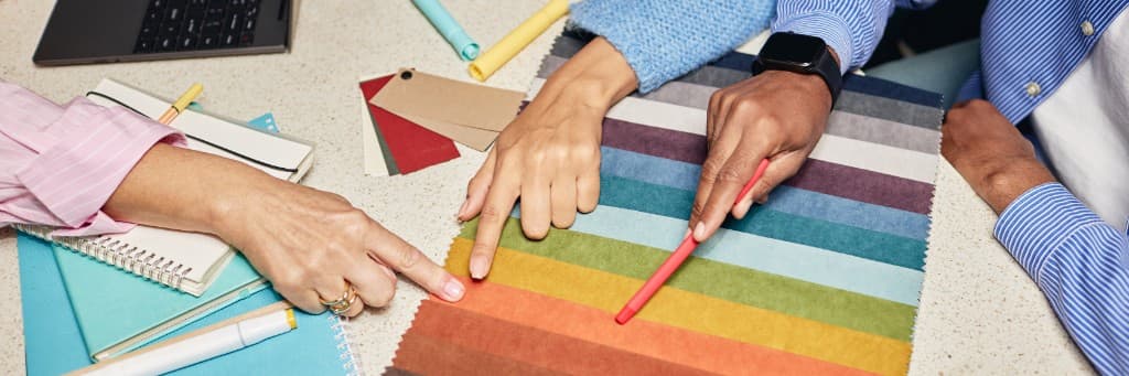 Curated material experience — designers selecting colours on textile samples